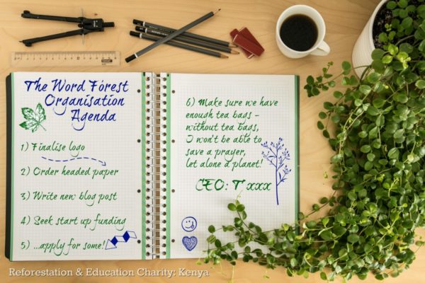 Notepad with meeting agenda for Word Forest Organisation