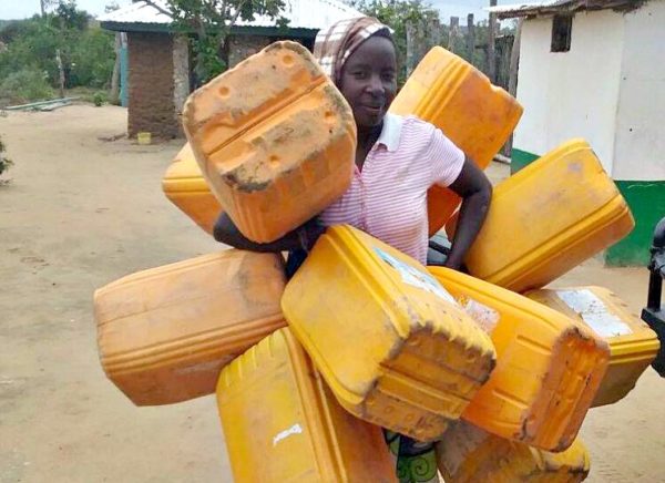 lady gathering the water buckets