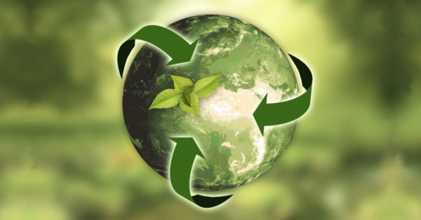 A green Earth from space with recycling symbol