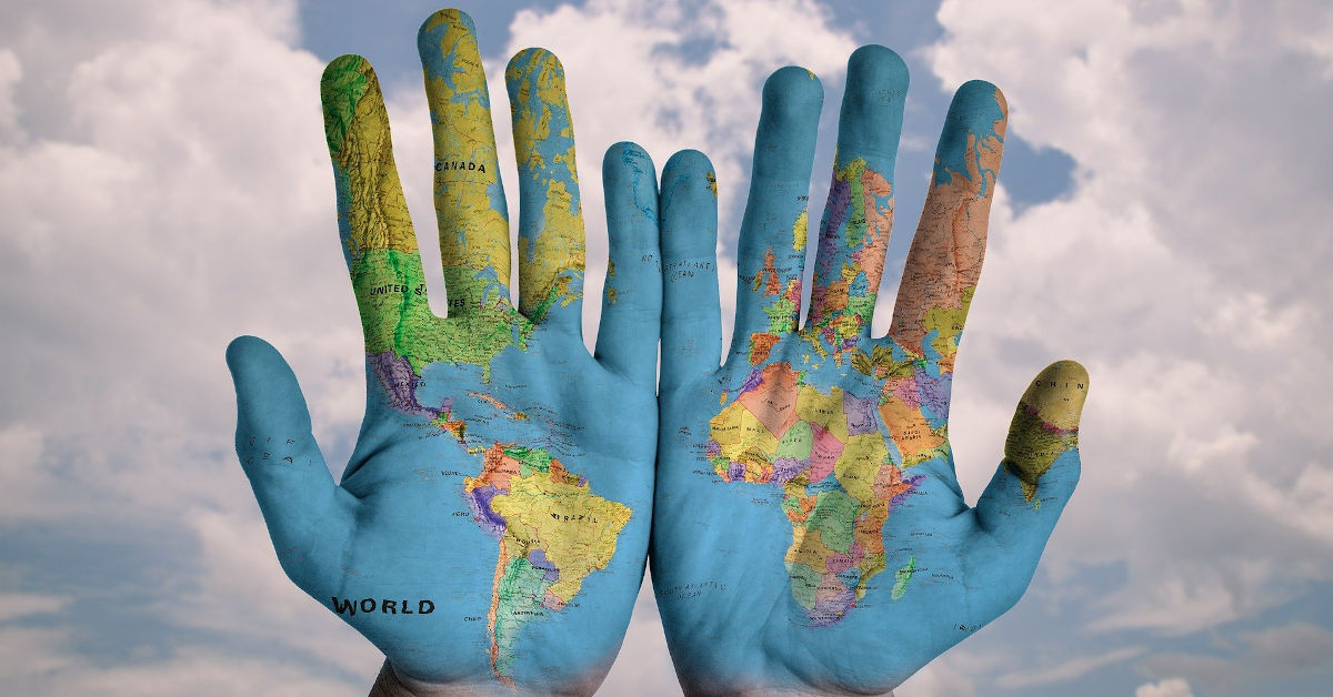 Hands painted with a map of the world Image by stokpic from Pixabay