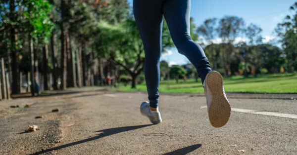 Woman running on a road by Daniel Reche from Pexels