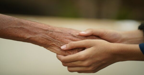 Young hands holding old hand