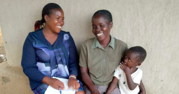 Joy Maseno and a new member of Mothers Of The Forest Rusinga Island branch with her child