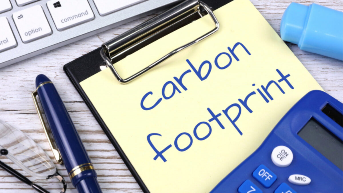 "Carbon Footprint" written on a sticky note with a calculator