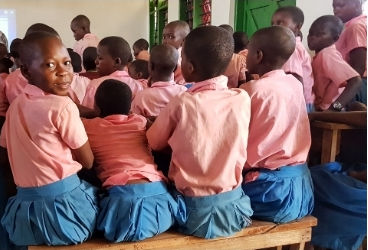 Kenyan children learning in a new classroom